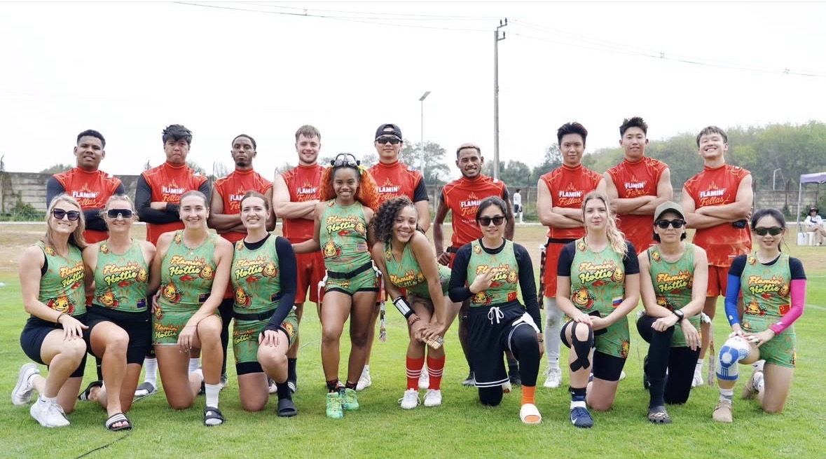 Flamin Hottie and Flamin Fellas international athletes together with Asia Smiley visible among the full team